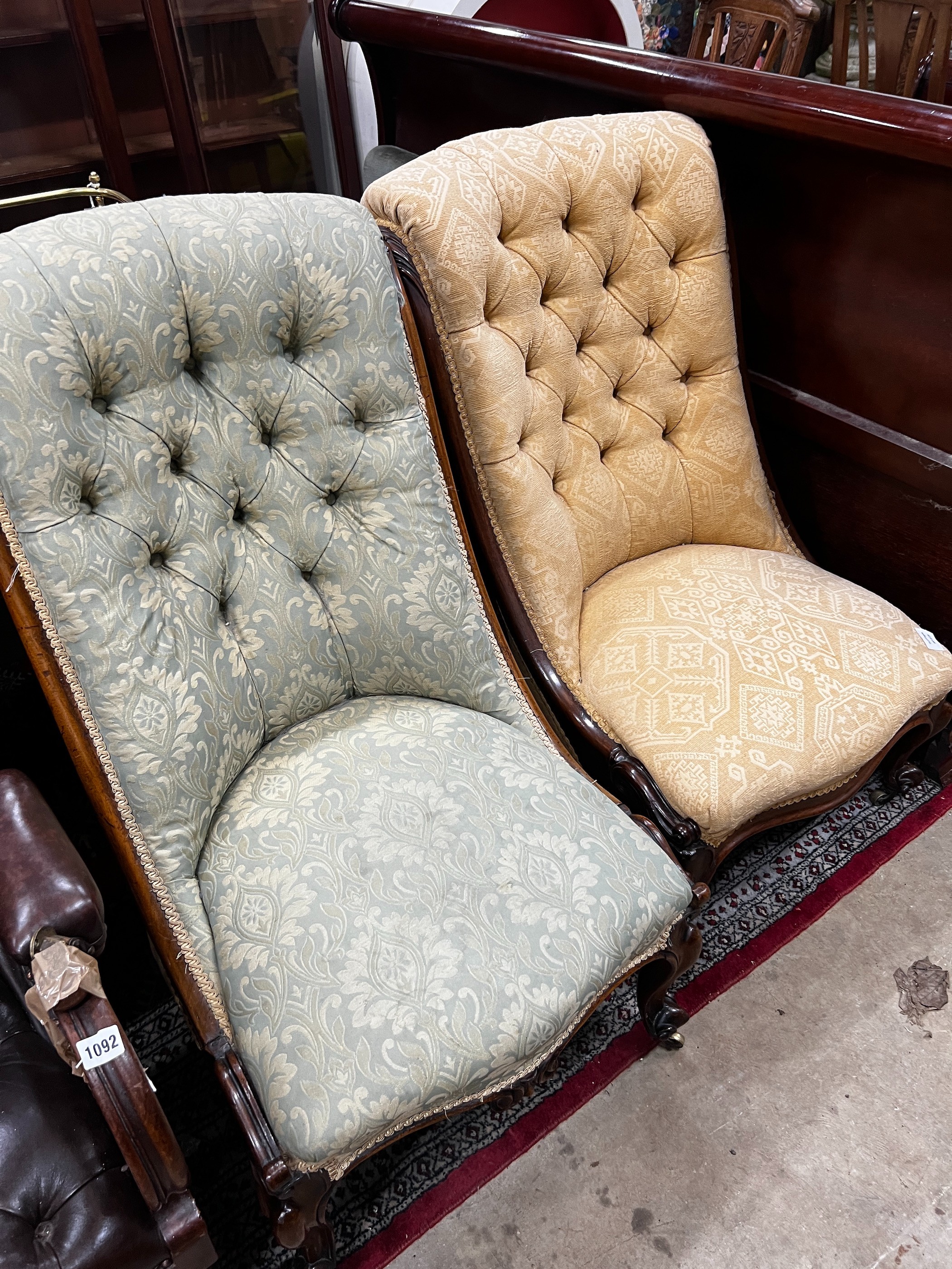 A near pair of Victorian mahogany and rosewood upholstered nursing chairs width 54cm, height 91cm *Please note the sale commences at 9am.